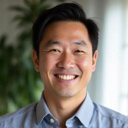 Portrait of James Chen, a man with a friendly demeanor.